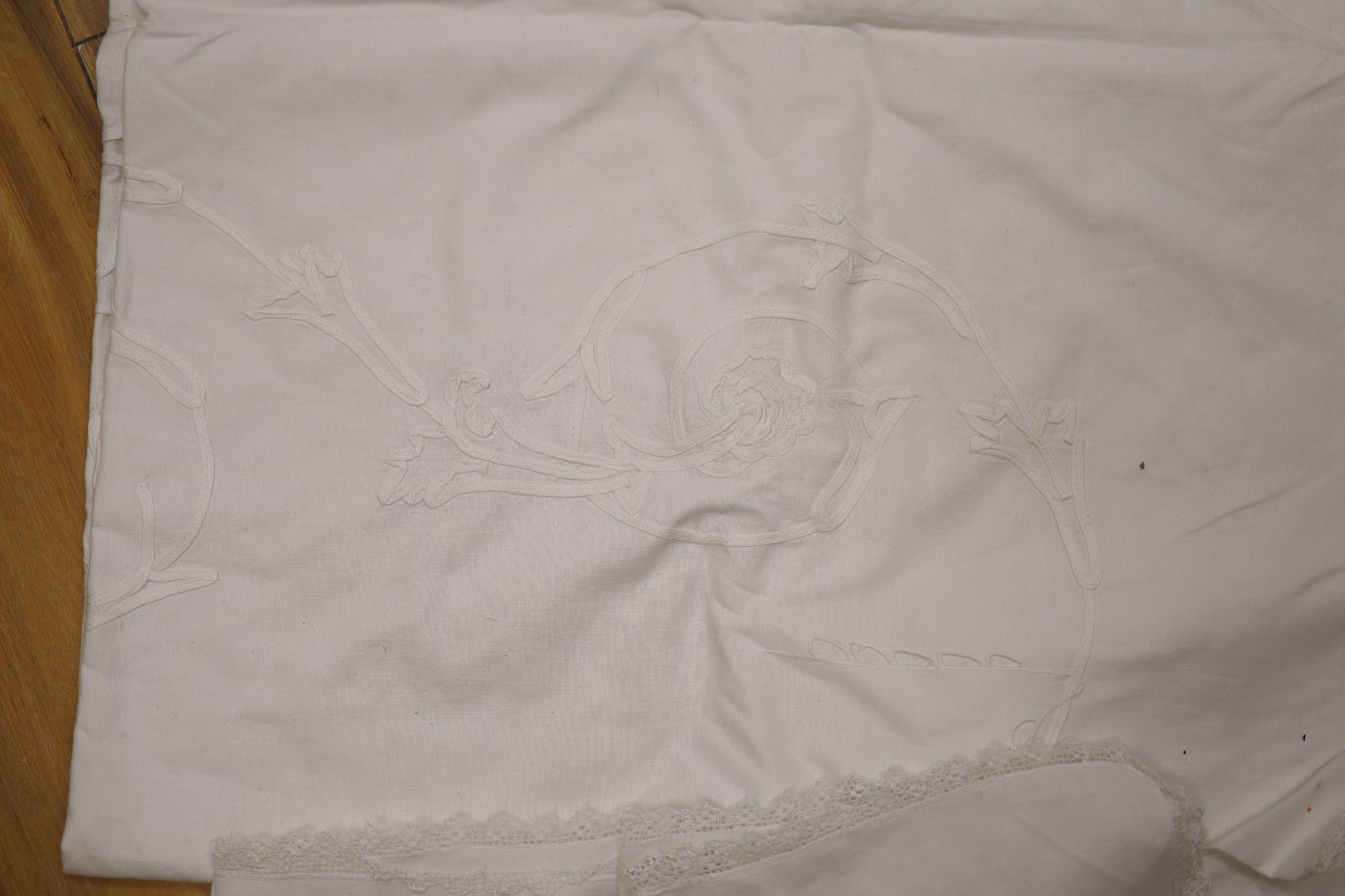 A patch worked filet lace and anglais cut work table cloth and six matching napkins, and another cloth